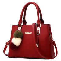 PU Leather Handbag with fur ball & attached with hanging strap Solid PC