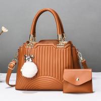 PU Leather Tote Bag Handbag with hanging ornament & attached with hanging strap & two piece Polyester striped Set